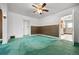 Bright living room featuring wood paneling and open doorway at 701 W Quincy Ave, Englewood, CO 80110