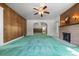 Spacious living room with wood paneling, brick fireplace, and archways at 701 W Quincy Ave, Englewood, CO 80110