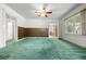 Open-concept living room with archways, wood paneling, and large windows at 701 W Quincy Ave, Englewood, CO 80110