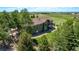 Aerial view of a two-story home with a sprawling green yard and a private balcony at 1505 Legacy Trl, Elizabeth, CO 80107