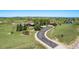 Breathtaking aerial view of a beautiful home nestled on a sprawling lot surrounded by lush greenery and trees at 1505 Legacy Trl, Elizabeth, CO 80107