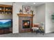 Close-up of the fireplace in the living room with mantle, decor, and adjacent built-in shelving at 1505 Legacy Trl, Elizabeth, CO 80107