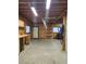 Bright garage space featuring workbenches, storage, concrete flooring, and exterior windows at 1505 Legacy Trl, Elizabeth, CO 80107