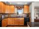 A cozy kitchen that features warm wood cabinets, sleek countertops, and stainless steel appliances at 1505 Legacy Trl, Elizabeth, CO 80107