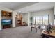 Spacious living room features a fireplace, sliding glass doors, and comfortable seating at 1505 Legacy Trl, Elizabeth, CO 80107