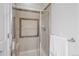 Tiled shower with a glass door and a built-in bench, combining style and functionality at 1505 Legacy Trl, Elizabeth, CO 80107