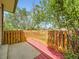 Outdoor wooden deck with orange rails showcases outdoor space perfect for entertainment at 1720 S Ammons St # A, Lakewood, CO 80232
