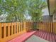 Outdoor living on wooden deck with orange painted rails offers a relaxing retreat at 1720 S Ammons St # A, Lakewood, CO 80232