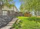 Well-maintained backyard with brick accents and stairway enhance outdoor appeal at 1720 S Ammons St # A, Lakewood, CO 80232