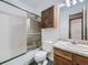 Bathroom featuring a vanity with a marble countertop and shower over bath at 1720 S Ammons St # A, Lakewood, CO 80232