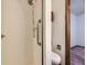 Bathroom featuring a white tiled shower with accessible grab bars at 1720 S Ammons St # A, Lakewood, CO 80232
