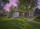 Charming brick home featuring a well-manicured lawn and mature tree at 1720 S Ammons St # A, Lakewood, CO 80232