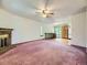 Open concept living room featuring a fireplace and staircase at 1720 S Ammons St # A, Lakewood, CO 80232