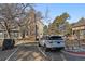 Residential building with a Range Rover parked in the driveway; speed limit sign says 5 mph at 1731 S Blackhawk Way # A, Aurora, CO 80012