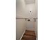 A utility room with a wood floor, an outlet for a washing machine and a wall outlet for the dryer at 1731 S Blackhawk Way # A, Aurora, CO 80012