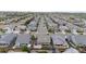 Aerial view of a residential neighborhood featuring neatly arranged homes along tree-lined streets at 15402 E 113Th Pl, Commerce City, CO 80022