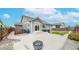 Backyard featuring a patio area, grassy lawn, privacy fence, and space for outdoor dining at 15402 E 113Th Pl, Commerce City, CO 80022