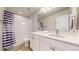 Clean bathroom with a tub, shower, and vanity at 15402 E 113Th Pl, Commerce City, CO 80022