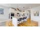 Kitchen featuring granite counters, stainless appliances, and stylish barstool seating at 15402 E 113Th Pl, Commerce City, CO 80022