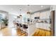 Modern kitchen featuring granite countertops, stainless steel appliances, and a kitchen island at 15402 E 113Th Pl, Commerce City, CO 80022