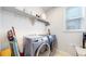 Functional laundry room with modern appliances at 15402 E 113Th Pl, Commerce City, CO 80022