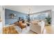 Inviting living room featuring stylish decor, hardwood floors, and plenty of natural light at 15402 E 113Th Pl, Commerce City, CO 80022