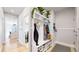 Well-organized mudroom with built-in storage, coat hooks, and seating near the home's entrance at 15402 E 113Th Pl, Commerce City, CO 80022