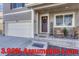 Charming home with a two-car garage, inviting front porch, and a beautifully decorated front door at 2262 Monte Vista St, Fort Lupton, CO 80621