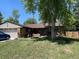 Charming single-story home with a well-manicured lawn and a cozy front porch at 9115 W 2Nd Ave, Lakewood, CO 80226