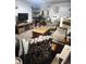 Cozy living room with rustic wood accents, comfortable seating, and decorative shelving creates a warm and inviting space at 9115 W 2Nd Ave, Lakewood, CO 80226