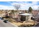 Aerial view of a complex of buildings with landscaping and parking at 936 Eudora St # 102, Denver, CO 80220