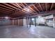 Unfinished basement with exposed beams and storage at 936 Eudora St # 102, Denver, CO 80220