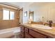 Updated bathroom with single vanity, tub, and shower at 936 Eudora St # 102, Denver, CO 80220