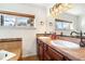 Bright bathroom featuring double sinks and a large mirror at 936 Eudora St # 102, Denver, CO 80220