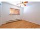 Bright bedroom with hardwood floors and ceiling fan at 936 Eudora St # 102, Denver, CO 80220