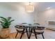 Bright dining area with glass table and four chairs at 936 Eudora St # 102, Denver, CO 80220