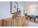 Mid-century modern dining area with light wood cabinet and round table at 936 Eudora St # 102, Denver, CO 80220