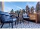 Small patio with seating area and decorative rug at 936 Eudora St # 102, Denver, CO 80220