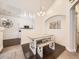 Bright dining area featuring a rustic table and seating next to the kitchen at 12941 Lafayette St # E, Thornton, CO 80241