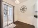 Eating area off of the kitchen featuring granite counters, dark wood floors, and access to the balcony at 12941 Lafayette St # E, Thornton, CO 80241