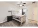 Comfortable main bedroom featuring plush carpeted floors, a ceiling fan, and a window for natural light at 12941 Lafayette St # E, Thornton, CO 80241