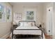 Well-lit bedroom with natural light, classic decor and warm hardwood floors at 187 S Pearl St, Denver, CO 80209