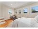 Comfortable bedroom with natural light, hardwood floors and a neutral color scheme at 187 S Pearl St, Denver, CO 80209