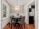 Charming dining room with modern lighting, a round table, and comfortable seating for four at 187 S Pearl St, Denver, CO 80209