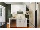 Modern kitchen with white cabinets, stainless steel appliances, and bright natural light at 187 S Pearl St, Denver, CO 80209