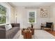 Inviting living room with neutral tones, comfortable seating, and a decorative rug at 187 S Pearl St, Denver, CO 80209