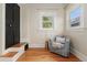 Cozy sitting area in a bedroom with hardwood floors and a comfortable chair at 187 S Pearl St, Denver, CO 80209