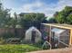 View of a beautiful backyard with a chicken coop and a greenhouse at 1115 Cherry Ct, Fort Lupton, CO 80621