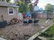Charming backyard with gravel area, seating, and playhouse at 1115 Cherry Ct, Fort Lupton, CO 80621