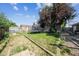 Spacious backyard featuring a trampoline and garden at 1115 Cherry Ct, Fort Lupton, CO 80621